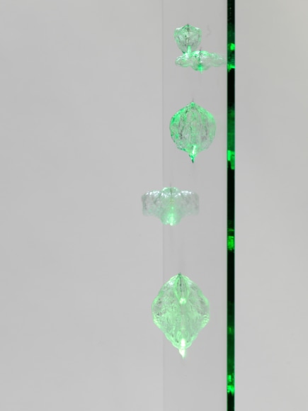 photos of a glass panel with a steel base