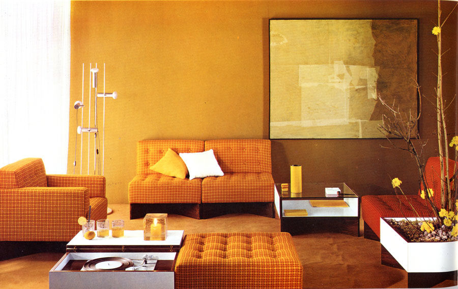 Archival image of a living room, seen in the photo is the tables by Pierre Guariche.