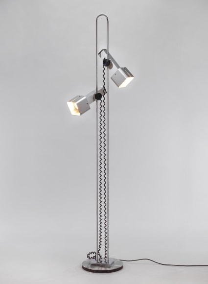 photograph of metal floor lamp in an empty room