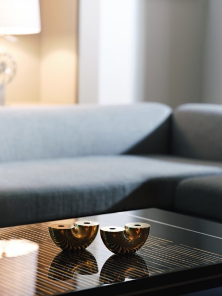 photograph of vases on a table in a room with furniture