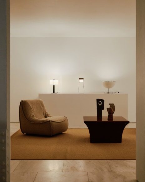 Installation view of works in the gallery, mostly furniture and some rugs and art.