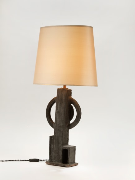 photograph of a geometric lamp in an empty room