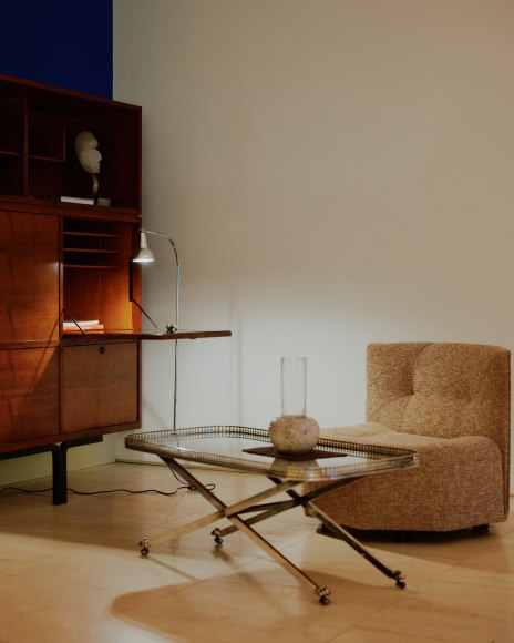 Installation view of works in the gallery, mostly furniture and some rugs and art.