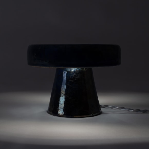 Illuminated lamp with dark blue raku glaze