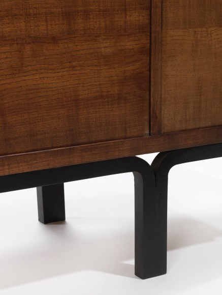 Wooden rounded foot of cabinet