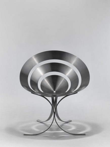 stainless steel chair in an empty room