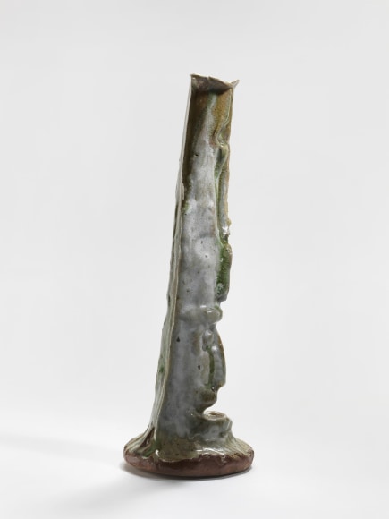 photograph of a cephalomorphic object in an empty room