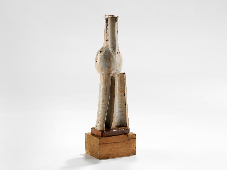 picture of a ceramic sculpture in a grey room