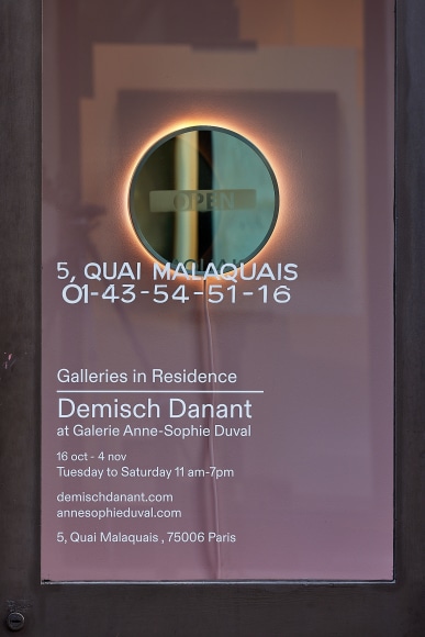 artist's installation of a mirror in a storefront
