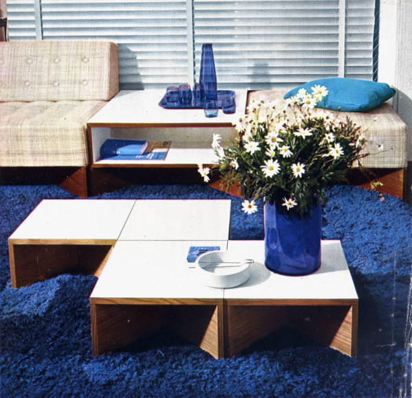 Archival image of a living room, seen in the photo is the tables by Pierre Guariche.