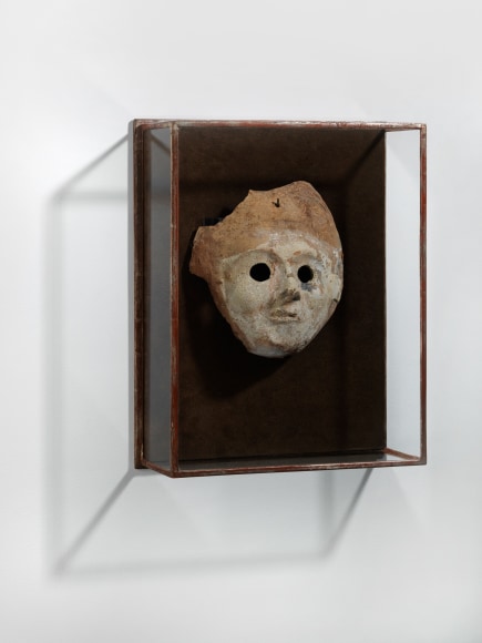 shadow box with a mask inside