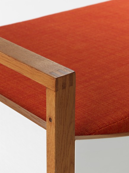 midcentury bed in an empty room