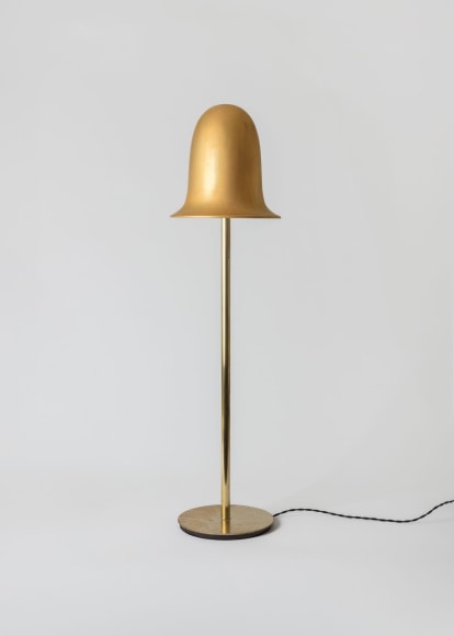 gold lamp in a gray room