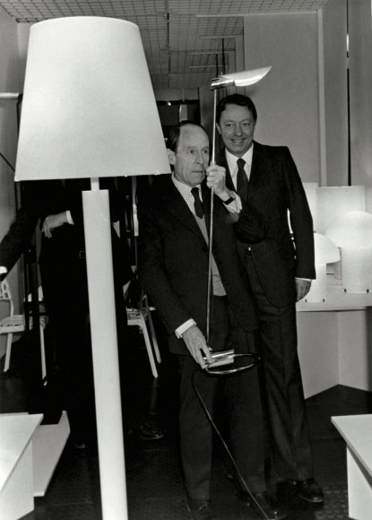 Archival image of Michel Jobert, Minister of Commerce between 1981 and 1983 and Verre Lumiere director Jacques Vidal. Lamp shown on right hand side