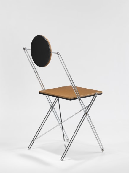 Black lacquered chair with tubular steel leg frame