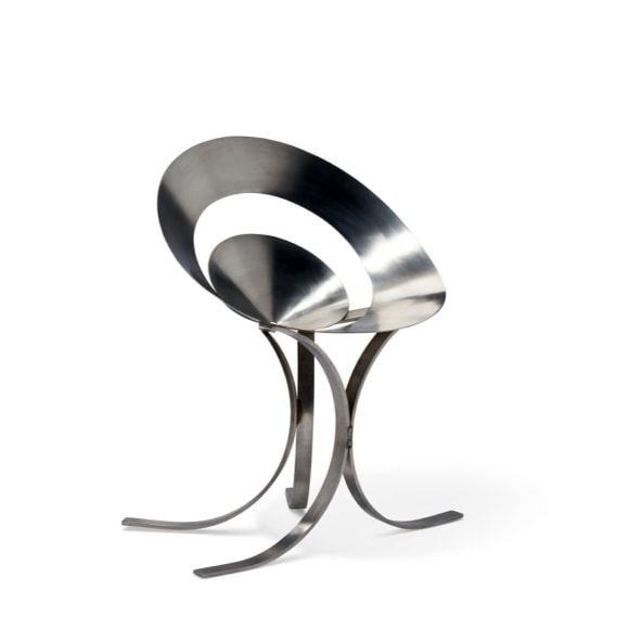 Maria pergay chair made with two rings in steel. On blank white background.