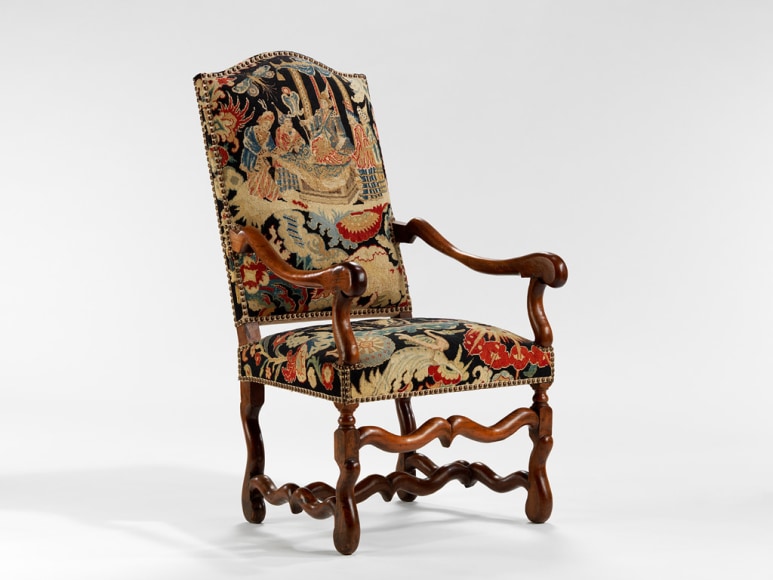 picture of a antique chair in a gray room