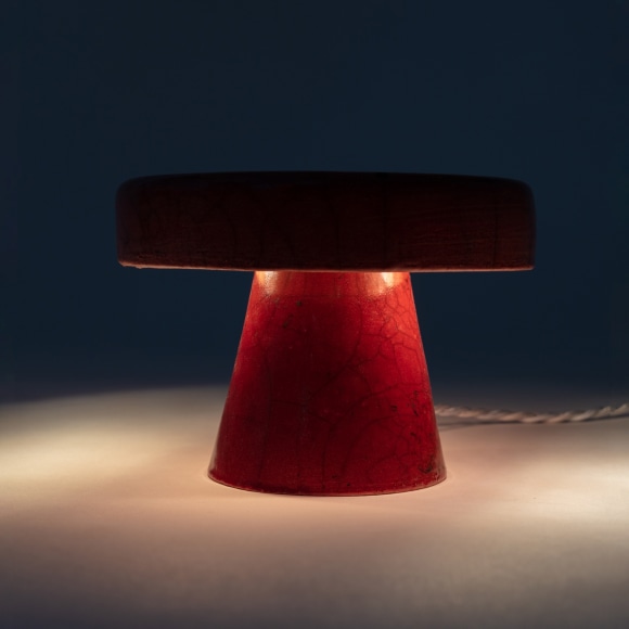 Illuminated lamp with burnt orange raku glaze