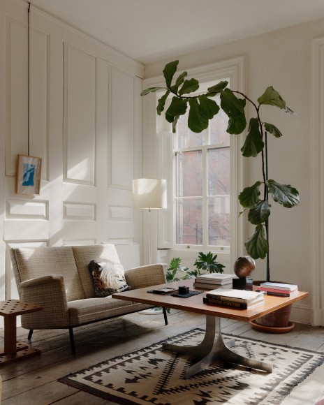 Suzanne Demisch&rsquo;s second living room features Sheila Hicks&rsquo;s&nbsp;Trouble Twill&nbsp;hanging above a Jonathan Muecke stool, a Jacques Dumond sofa, and a floor lamp by Etienne Fermigier. On the table by Joseph-Andr&eacute; Motte, a wooden tray by Alexandre Noll, a box by Maria Pergay, and&nbsp;Espace Int&eacute;rieur&nbsp;by Takis. (Photo: William Jess Laird)