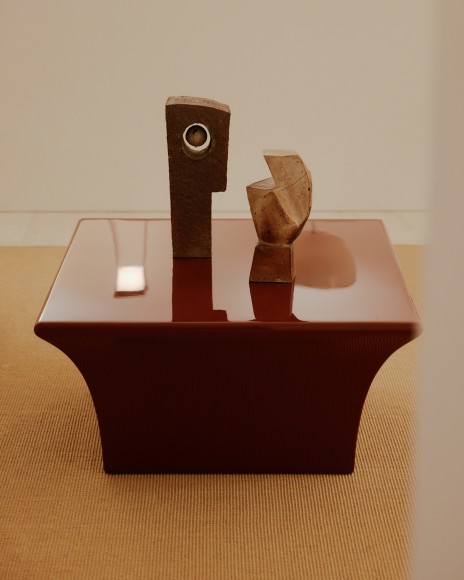 Installation view of works in the gallery, mostly furniture and some rugs and art.