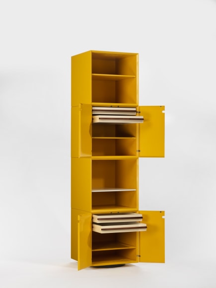 photograph of a yellow cabinet in a blank room