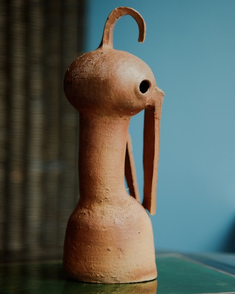 photo of a ceramic in a room at a gallery