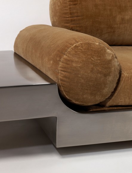 Detail close up of Maria pergay daybed with brown upholstery and steel frame.