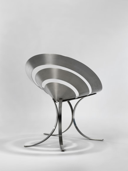 stainless steel chair in an empty room