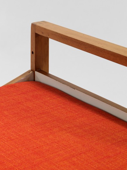 midcentury bed in an empty room