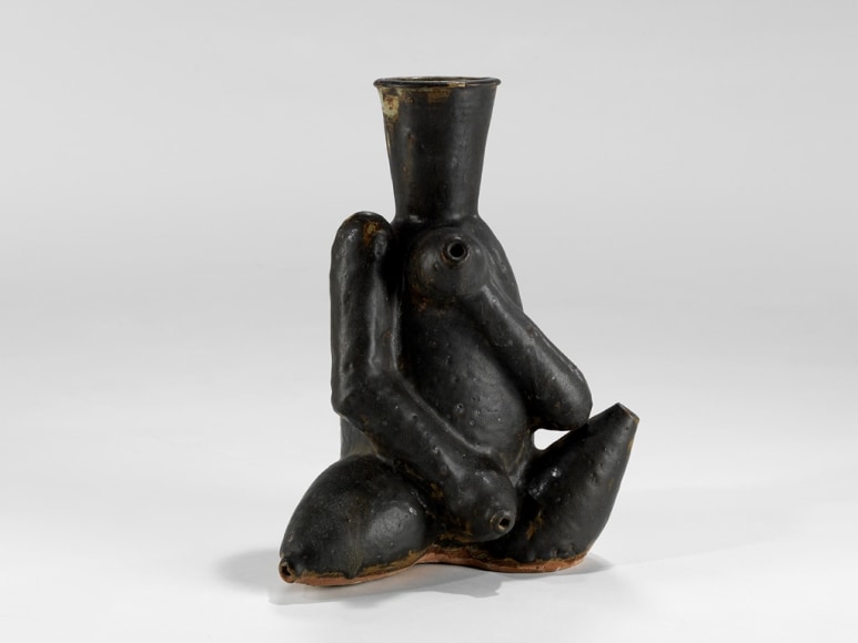 picture of a ceramic sculpture in a grey room