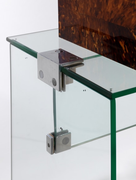 Jacques Dumond console vanity with a box on top. made of glass and has a stool that sits with it. green inside the box. Detail of the piece.