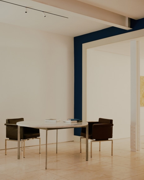 Installation view of works in the gallery, mostly furniture and some rugs and art.