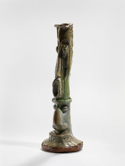 photograph of a cephalomorphic object in an empty room