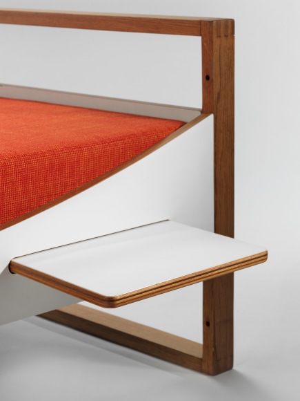 midcentury bed in an empty room