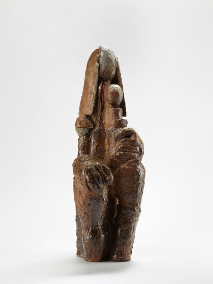 photograph of a brown sculpture in an empty room
