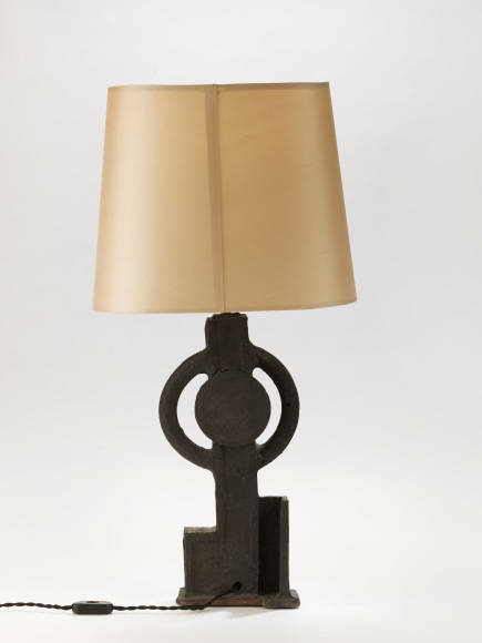 photograph of a geometric lamp in an empty room