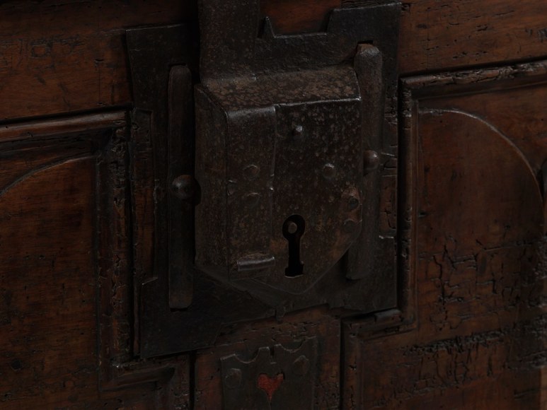 picture of a medieval trunk in a gray room