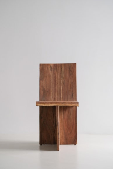 wood and cork chair with angled back shown in every angle against a grey background.