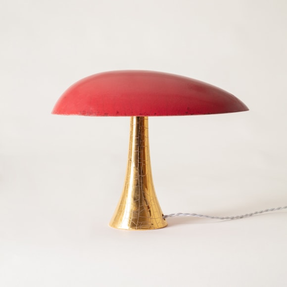 Lamp with a red raku glazed shade and gold raku glazed base