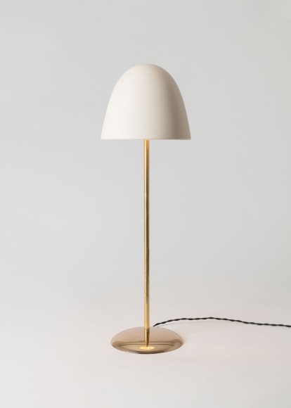 minimal gold lamp in an empty room