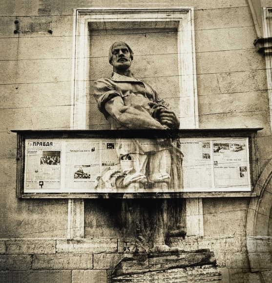 Untitled (a sculpture of a peasant is crucified by pravda (truth) newspaper’s stand), c. 1986-1988, Vintage sepia-toned gelatin silver print