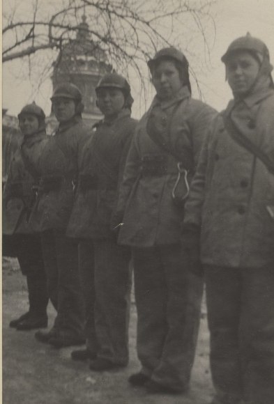 Many Leningrad girls have joined the volunteer fire fighter brigades. They successfully combat fires caused by enemy shells and fire-bombs
