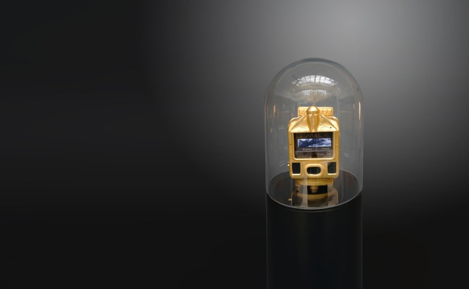 Ghiora Aharoni, When All Roads Are One, 2017, assemblage sculpture with vintage Indian taxi meter encased in 23-karat gold leaf retrofitted with two screens, 139.7 x 30.5 x 30.5 cm (55 x 12 x 12 inches)