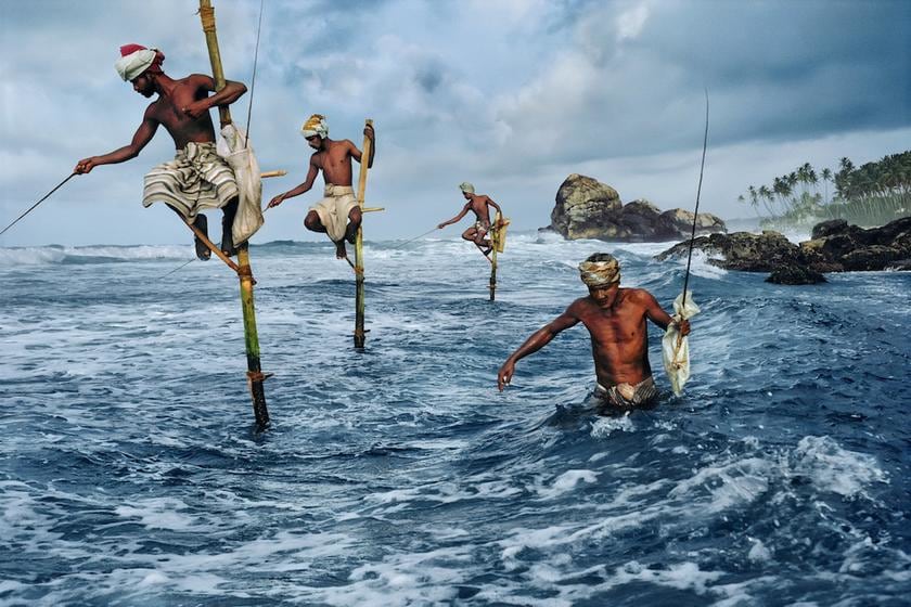 , Steve McCurry, Stilt fishermen, Weligama, South coast, Sri Lanka, 1995, ultrachrome print, 20 x 24 inches/50.8 x 60.96 cm; © Steve McCurry