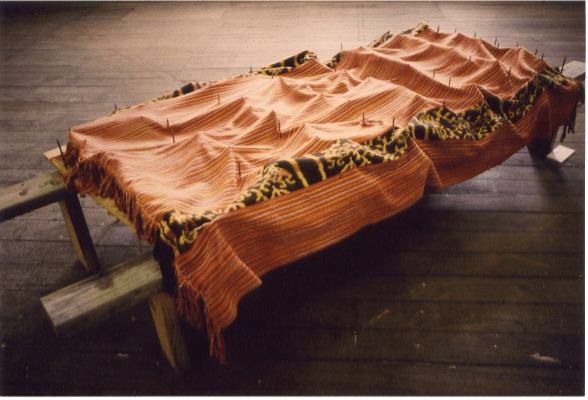 Maria Madeira, Silensiu Folin Hira? (Silencio a Que Pre&ccedil;o?; What Price Silence?), 1996, mixed media: metal, wood, wire, tais (traditional East Timorese cloth), 200 x 100 cm (78.7 x 39.4 inches)