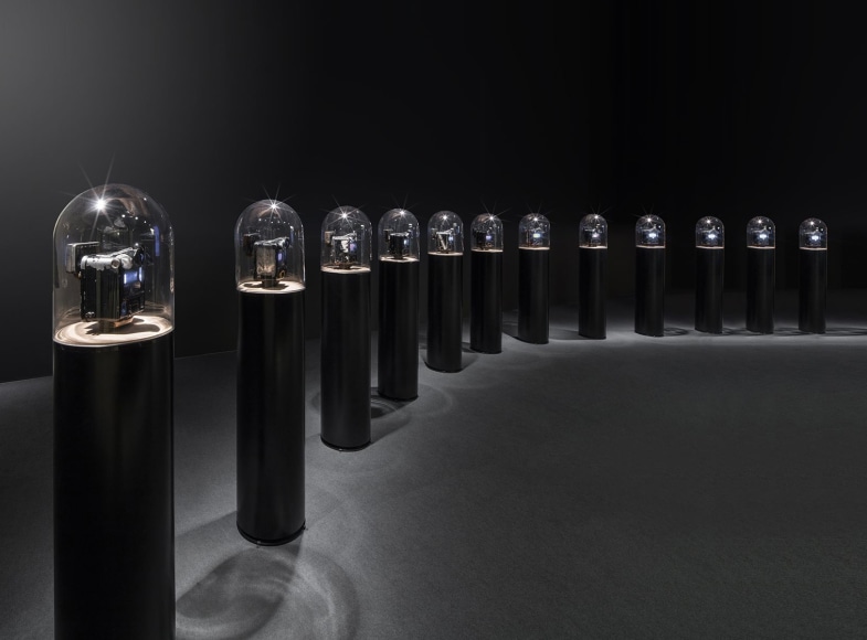 Ghiora Aharoni, The Road to Sanchi, 2016, assemblage sculpture with vintage Indian taxi meter retrofitted with two screens displaying videos filmed by the artist in India, mounted on a circular wooden platform on a cylindrical steel base with a glass dome, 139.7 x 29.5 cm (55 x 11.6 inches) each