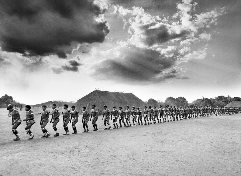 Sebastião Salgado, Kuikuro warriors, Xingu Indigenous Territory, state of Mato Grosso, Brazil, 2005, gelatin silver print, 152.4 x 228.6 cm (60 x 90 inches) © Sebastião Salgado