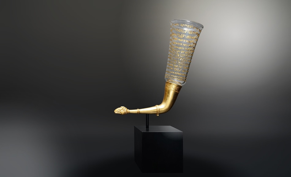 The Moses Cup III, 2019, hand-blown glass vessel with engraved text in-filled with 23-karat gold, 23-karat gold leafed, vintage replica rhyton and steel base, 26 x 19 x 7 inches/66 x 48.3 x 17.8 cm