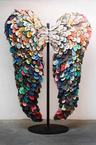 Alfredo and Isabel Aquilizan, Last Flight, 2009, used slippers and metal stand, 275 x 198 cm (107.3 x 77.2 inches)