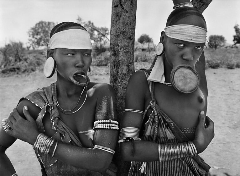 Mursi Village of Dargui in Mago National Park, near Jinka, Ethiopia (two women with lip plates),&nbsp;2007, gelatin silver print, 20 x 24 inches/50.8 x 61 cm &copy; Sebasti&atilde;o Salgado